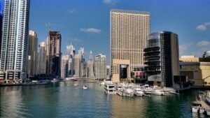 A Dubai Marina hotel tower with marina water and promenade in view, away from Dubai ATM week hotels on the Trade Centre strip.