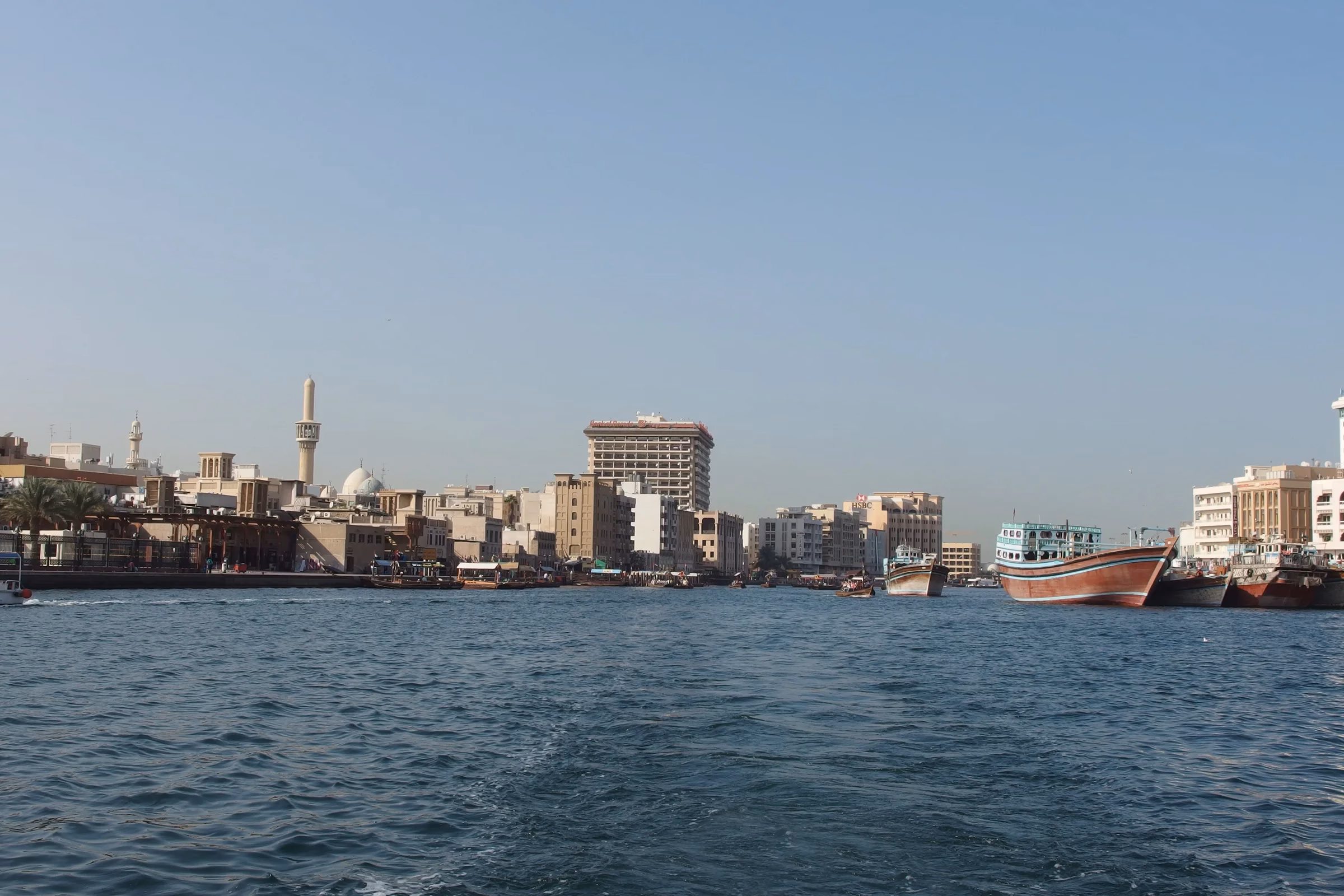 View from a traditional abra crossing Dubai Creek towards the Deira waterfront, the short boat ride to the Gold Souk