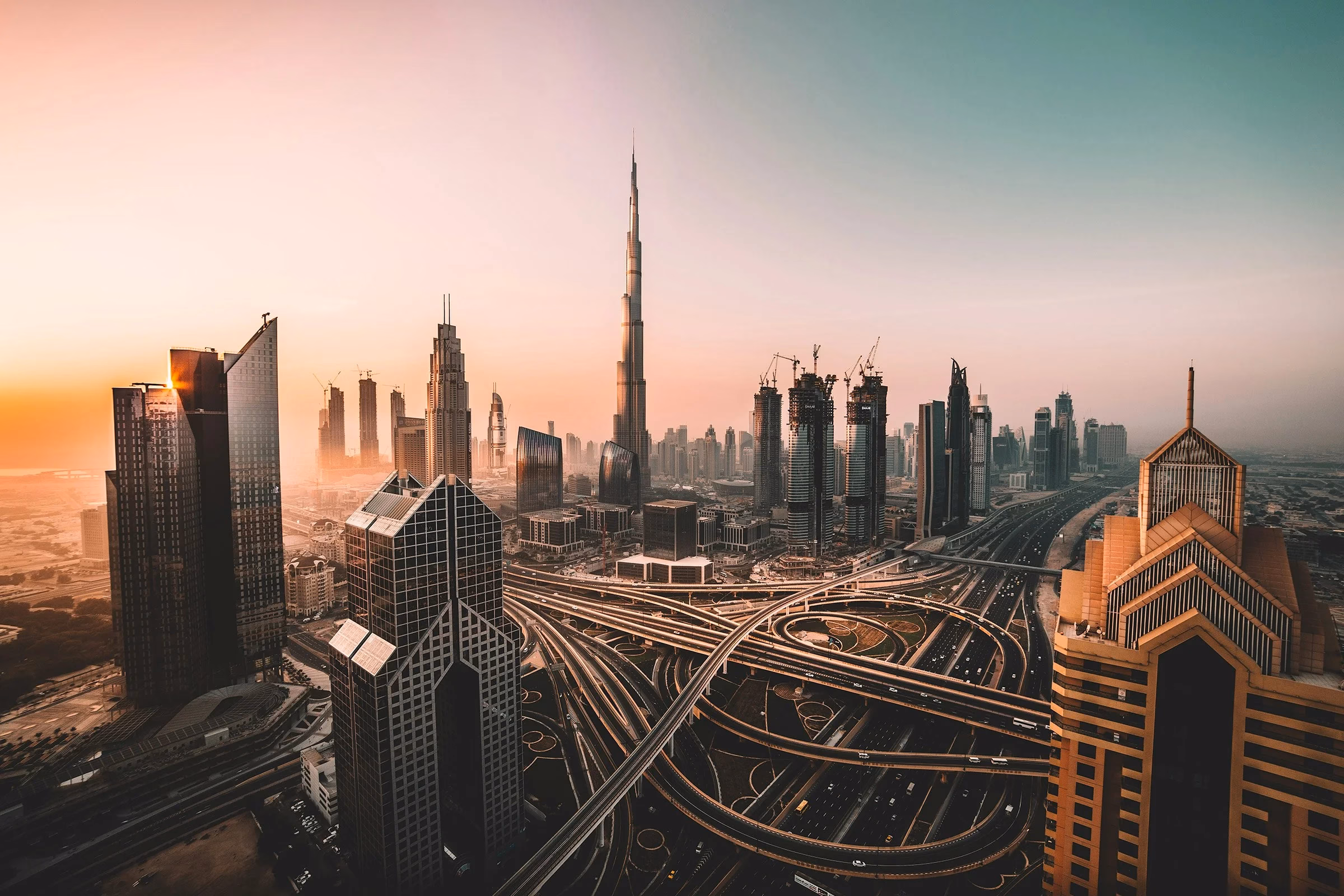 Sunrise view of Dubai highways and skyline near Downtown, illustrating morning Dubai cycling race traffic planning