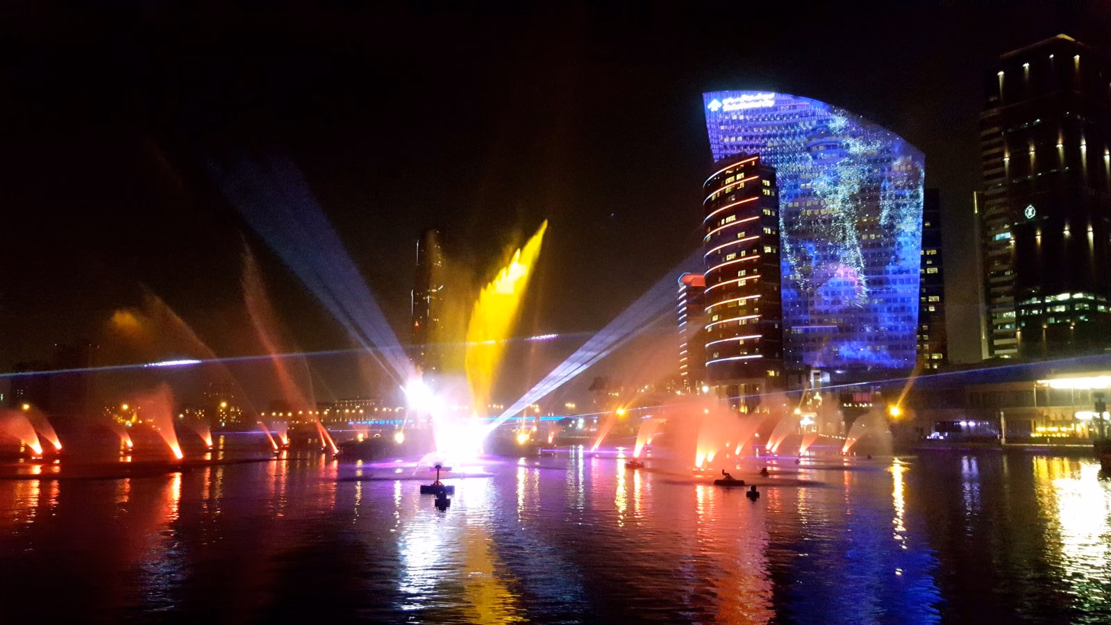 Laser, light and water fountain show over the water at Dubai Festival City at night