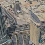 Aerial view of Downtown Dubai roads beside Burj Khalifa and Dubai Mall, the end of the planned Dubai Loop tunnel route from DIFC