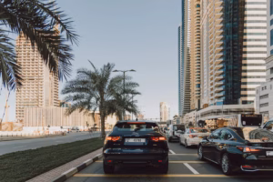 Cars queuing in Dubai traffic beside high-rise towers, a reminder to follow Dubai car insurance scam tips before renewing online