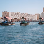 Traditional abras crossing Dubai Creek, the starting point of a Sheikh Rashid heritage trail through old Dubai