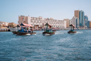 Traditional abras crossing Dubai Creek, the starting point of a Sheikh Rashid heritage trail through old Dubai