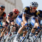 Cyclists in a road race peloton illustrating the Proud of the UAE cycling race in Dubai