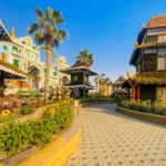 Colourful pavilions and flower-lined walkway at Global Village, a highlight of our Dubai October 2026 guide